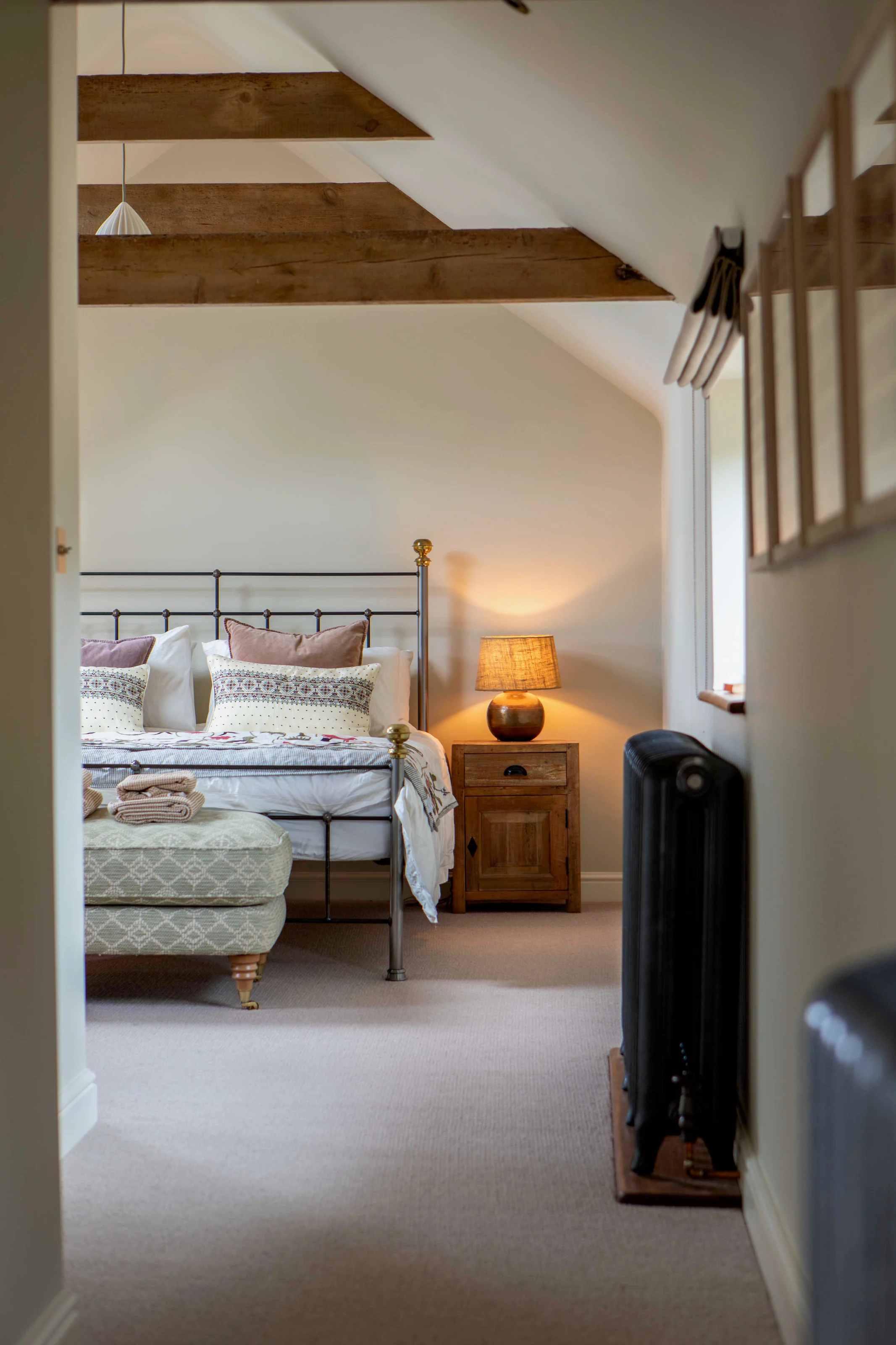 The king size bed for a good night's sleep under the original beams