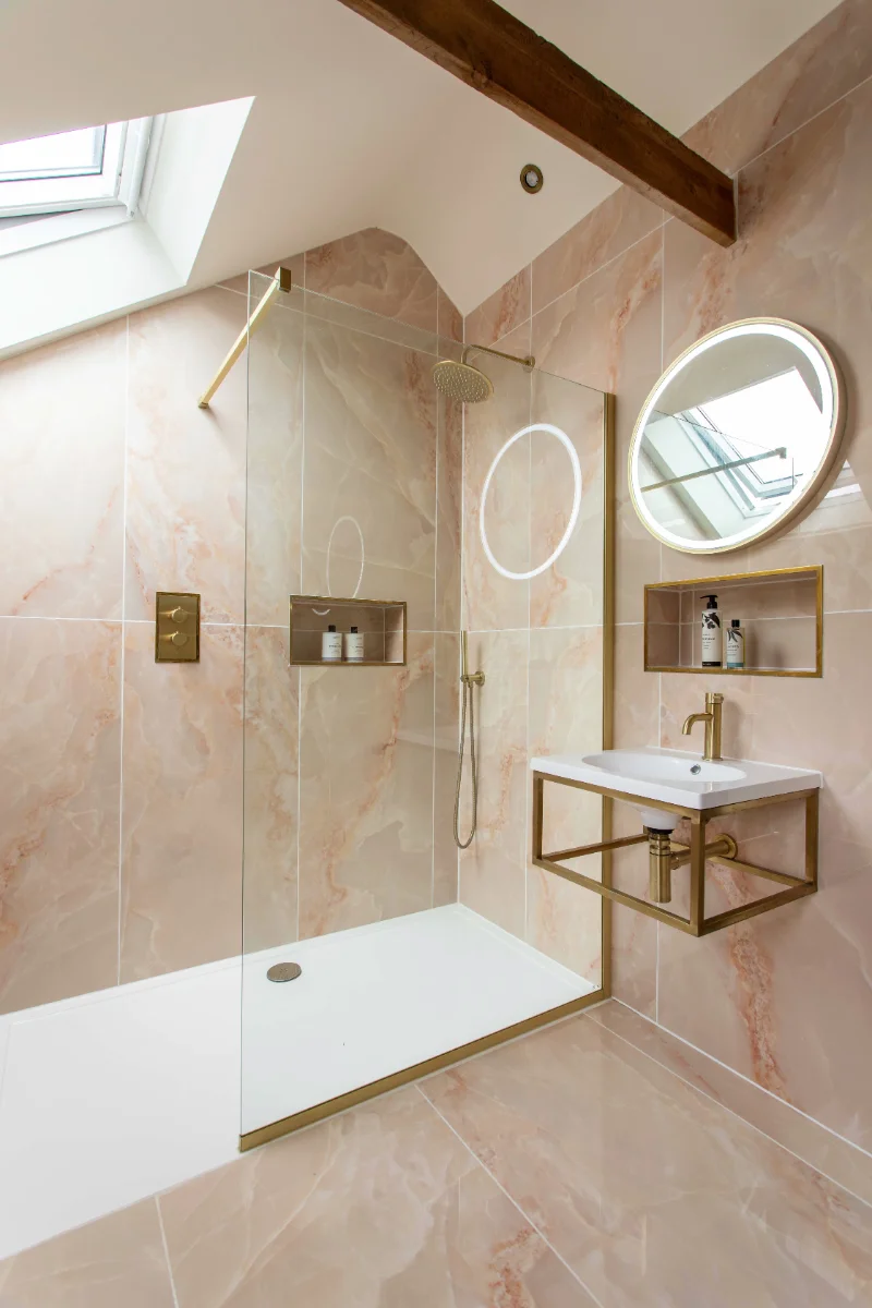 The Granary bathroom with deep bath, walk-in shower and rooflight