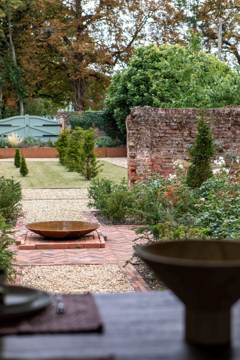The rose courtyard looking out towards the garden