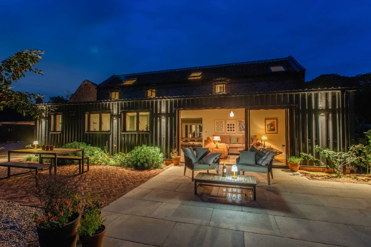The Granary and its private back patio at dusk